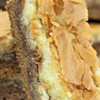A stack of harvest spice cake bars on a plate.