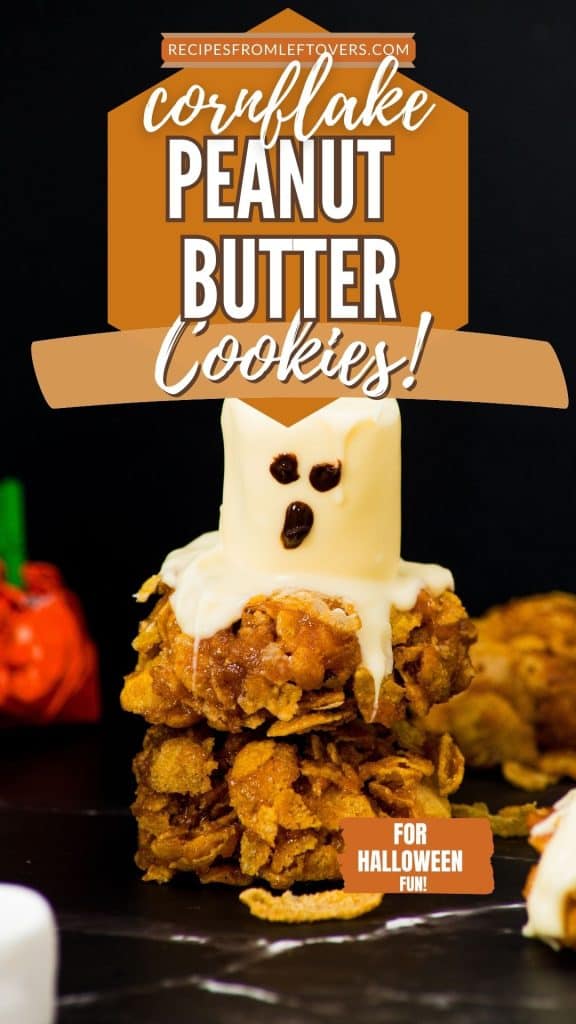 Crispy cornflake peanut butter cookies decorated for Halloween with ghost face on a black background, homemade leftover treat for festive dessert ideas.